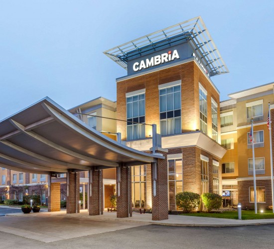 Hotel exterior at dusk with lights